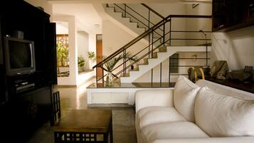 Deluxe Double Room, Patio | Living area | Flat-screen TV