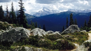 A mountain trail with large rocks and sparse vegetation. - Belle Neige Suites- Whistler (Whistler)