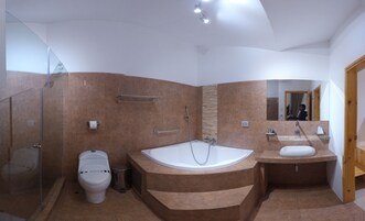 Junior Suite, Pool View | Bathroom | Shower, free toiletries, towels