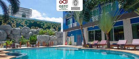 Outdoor pool, open 8:00 AM to 8:00 PM, pool loungers