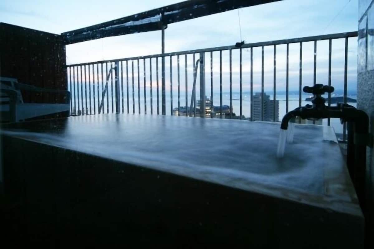 traditional room, hot tub, ocean view | deep-soaking bathtub