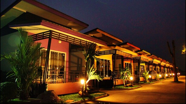 A row of modern hotel rooms with large windows and a covered outdoor area. - D-Sine Resort (Buriram)