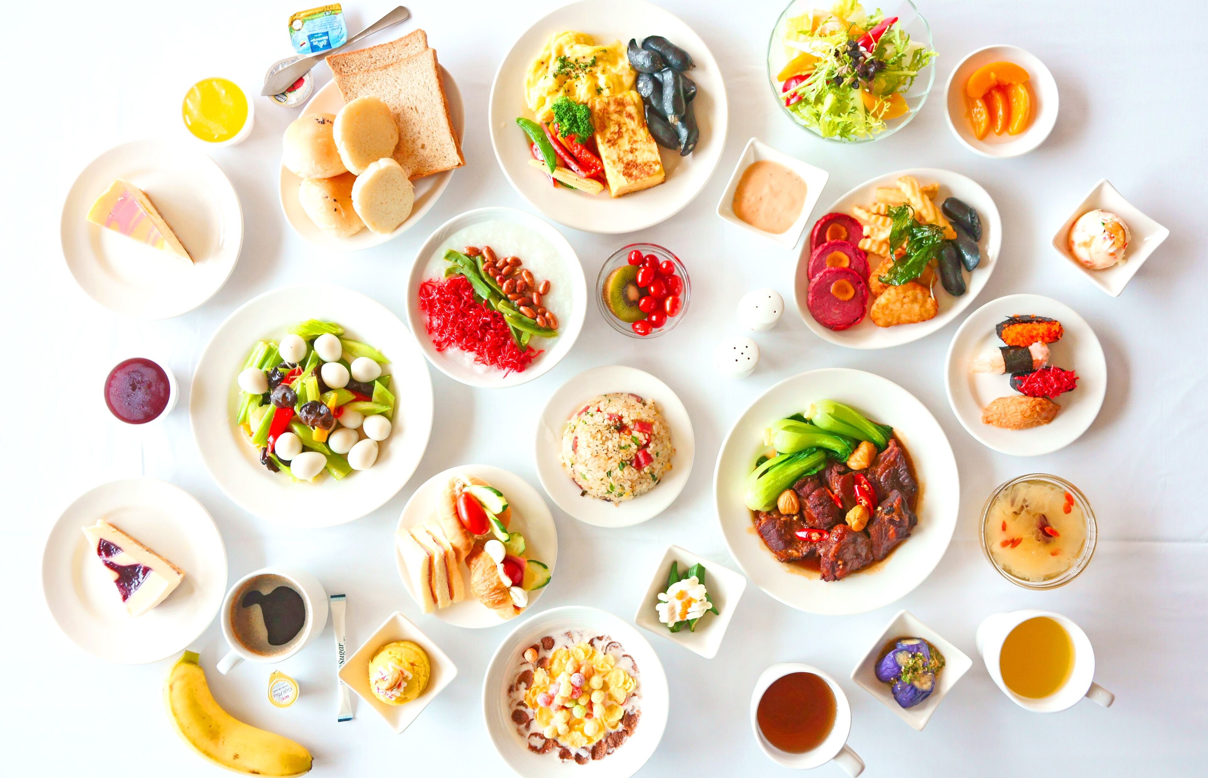 A variety of dishes and drinks arranged on a table.