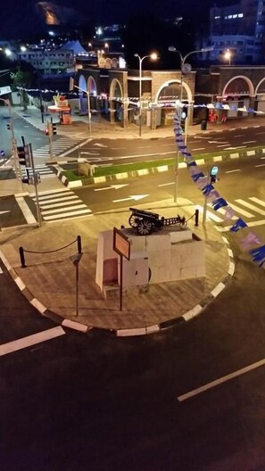 A roundabout intersection with traffic lights and a pedestrian crossing. - Tiberias Hostel (Tiberias)
