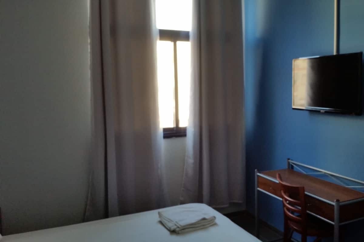 Desk, free WiFi, bed sheets