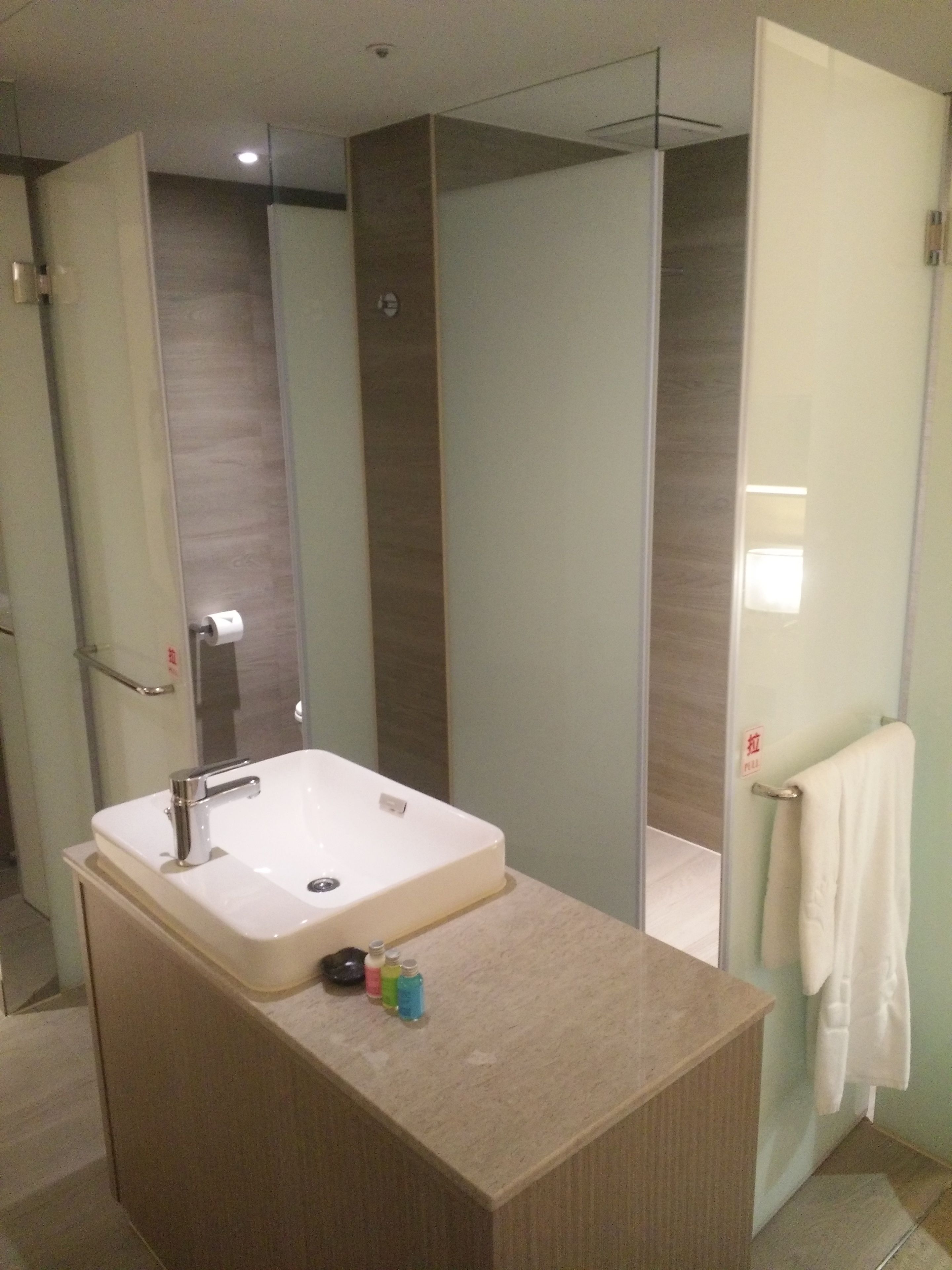 eco-friendly toiletries, hair dryer, slippers, towels