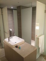 Eco-friendly toiletries, hair dryer, slippers, towels
