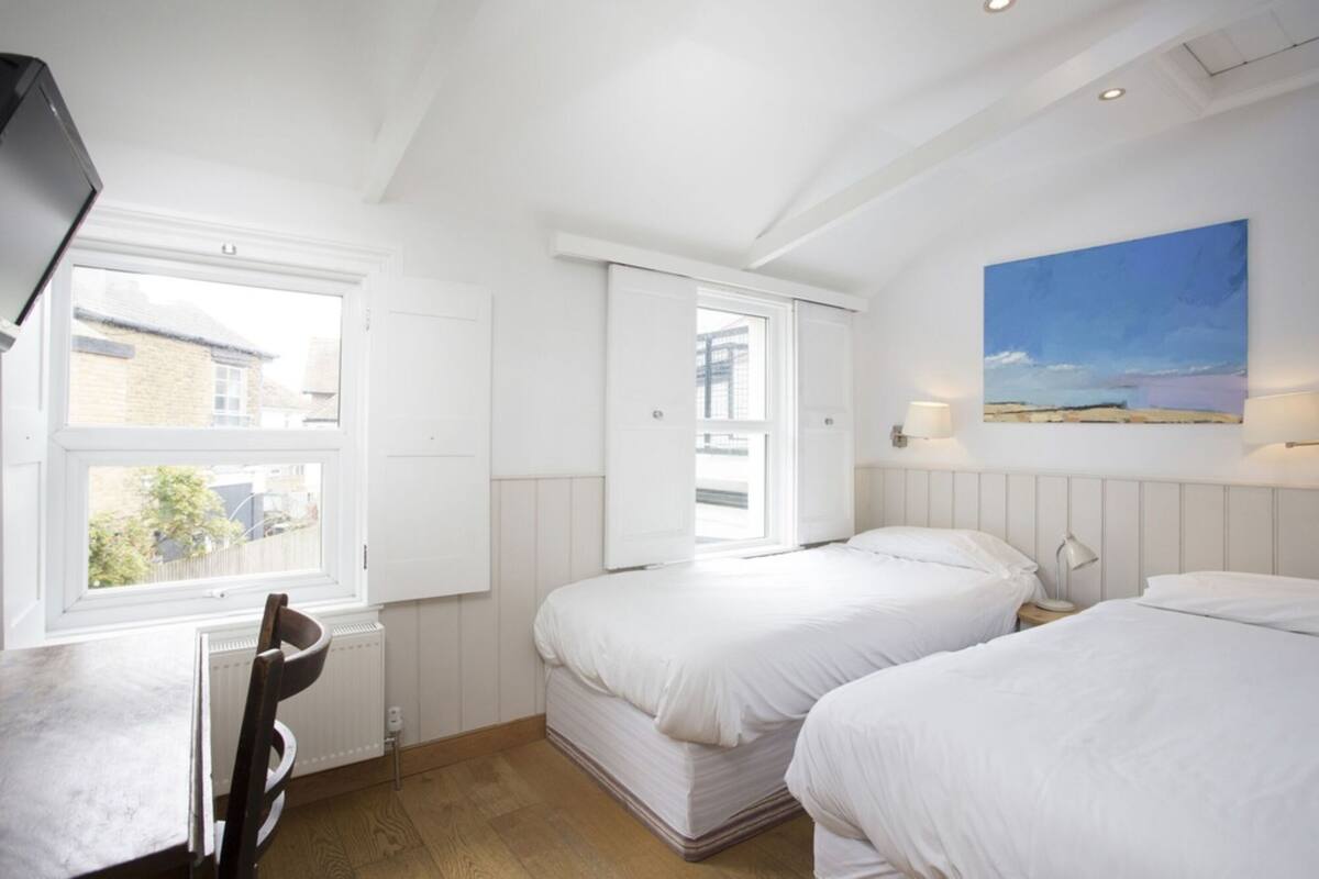 family quadruple room, multiple beds | desk, iron/ironing board, free wifi