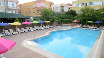 Seasonal outdoor pool, open 10:00 AM to 8:00 PM, pool umbrellas