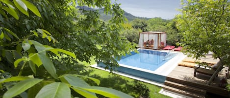 Outdoor pool, pool umbrellas, pool loungers