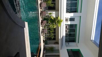 Outdoor pool, open 8:00 AM to 9:00 PM, pool loungers