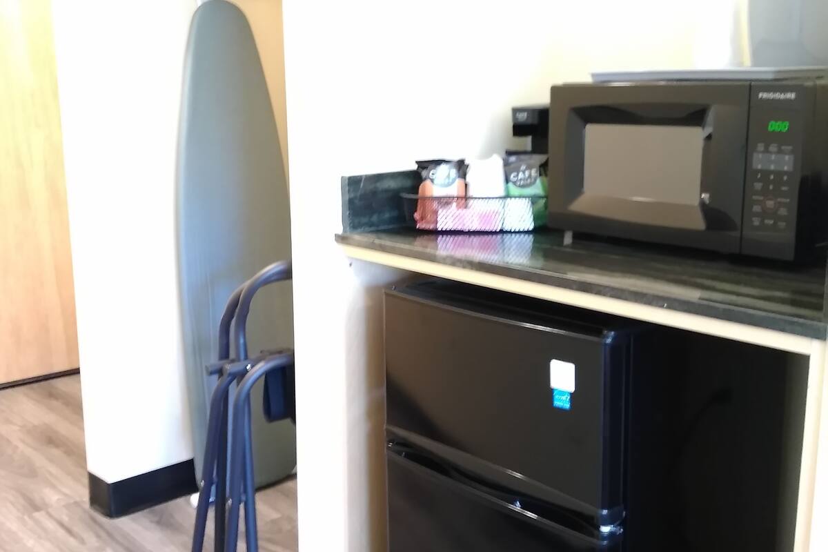 individually decorated, desk, blackout curtains, iron/ironing board