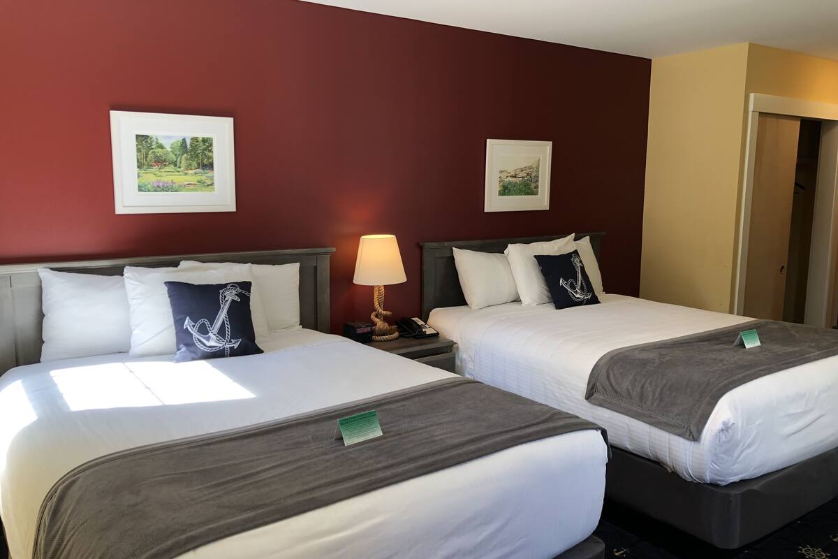 economy room, 2 queen beds | individually decorated, desk, blackout curtains, iron/ironing board