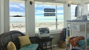 A room with a view of the beach, a 'NO VACANCY' sign, and a telephone number. - The Ocean View (Centerville)