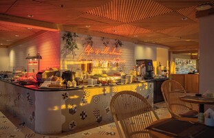 Daily buffet breakfast (USD 15 per person)