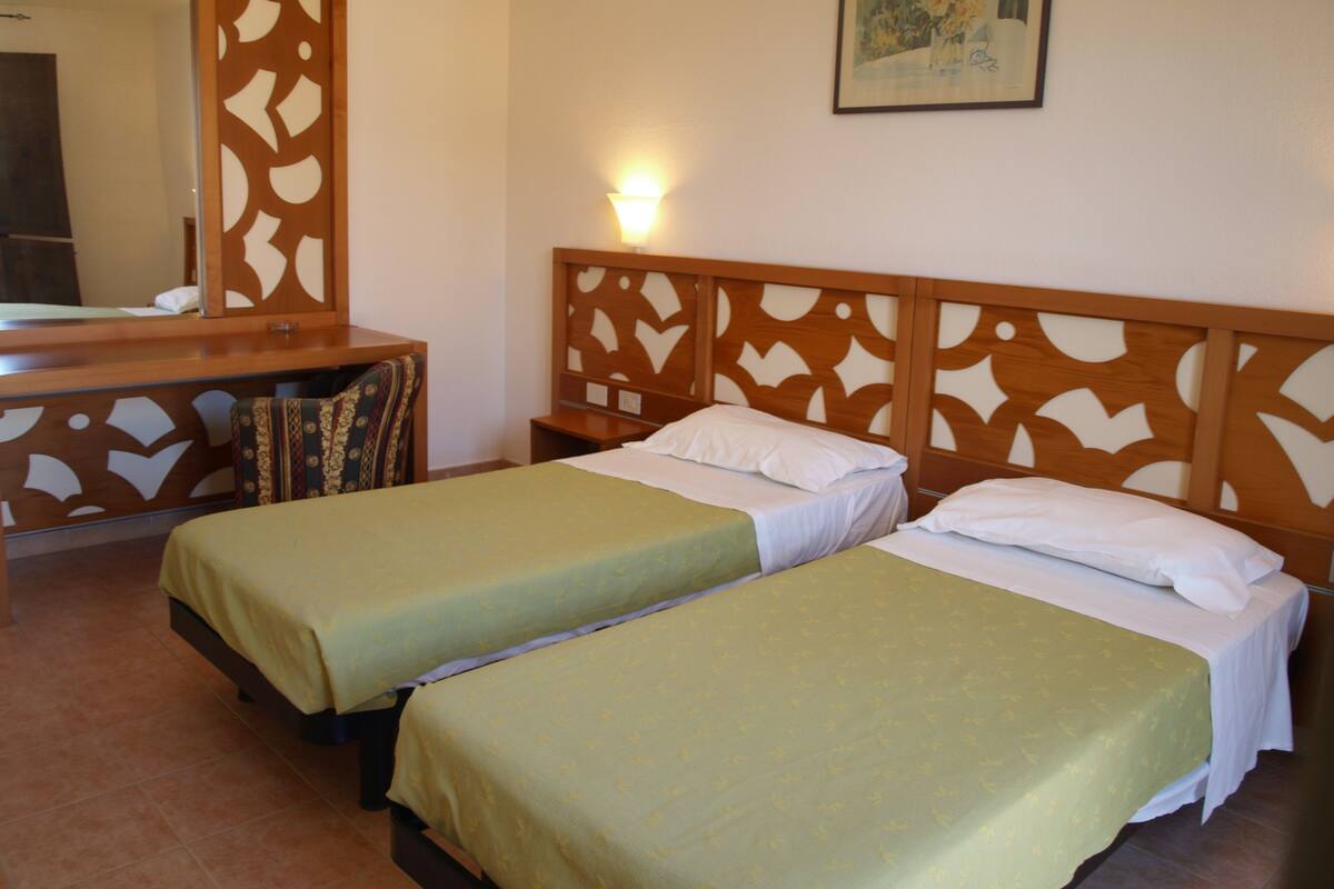 Standard Double or Twin Room | Cots/infant beds, bed sheets