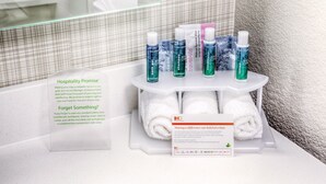 Toiletries and towels on a hotel bathroom counter. - Holiday Inn Express & Suites Cleveland West - Westlake by IHG (Westlake)