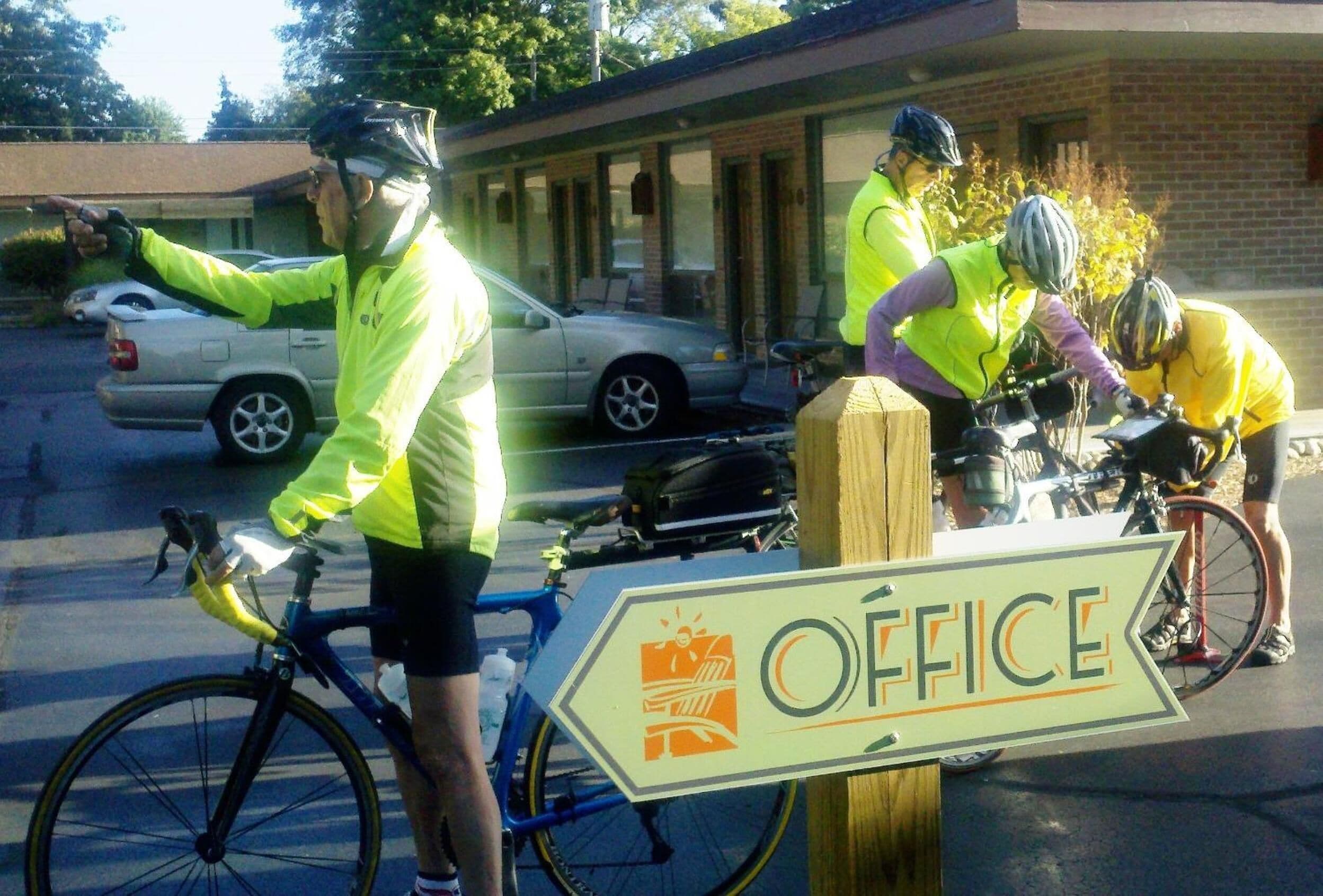 A sign with the word "OFFICE" and a bicycle symbol.