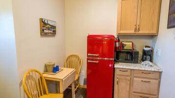 Family Room, 1 King Bed (King Room with Roll-In Shower - Disab) | Private kitchen | Fridge, microwave, coffee/tea maker, toaster
