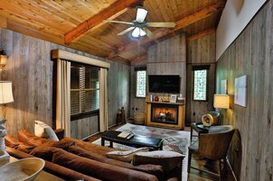 Deluxe Cabin, Multiple Beds, Hot Tub, Valley View | Living area | 50-inch Smart TV with cable channels, table tennis