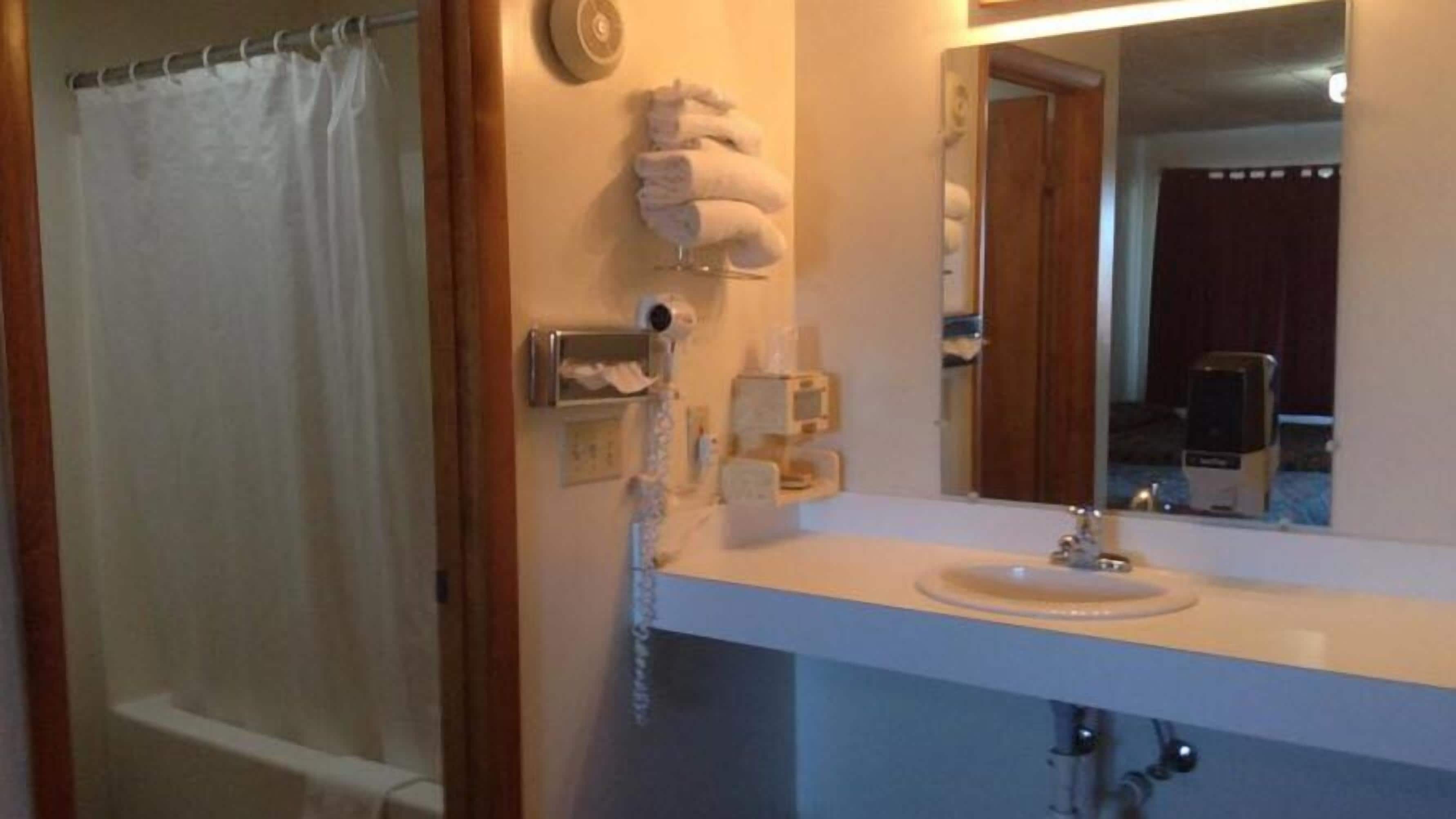 Room, 2 Double Beds | Bathroom | Combined shower/tub, hair dryer, towels