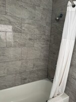 Standard Room, 1 King Bed, Non Smoking | Bathroom | Combined shower/tub, deep soaking tub, hair dryer, towels