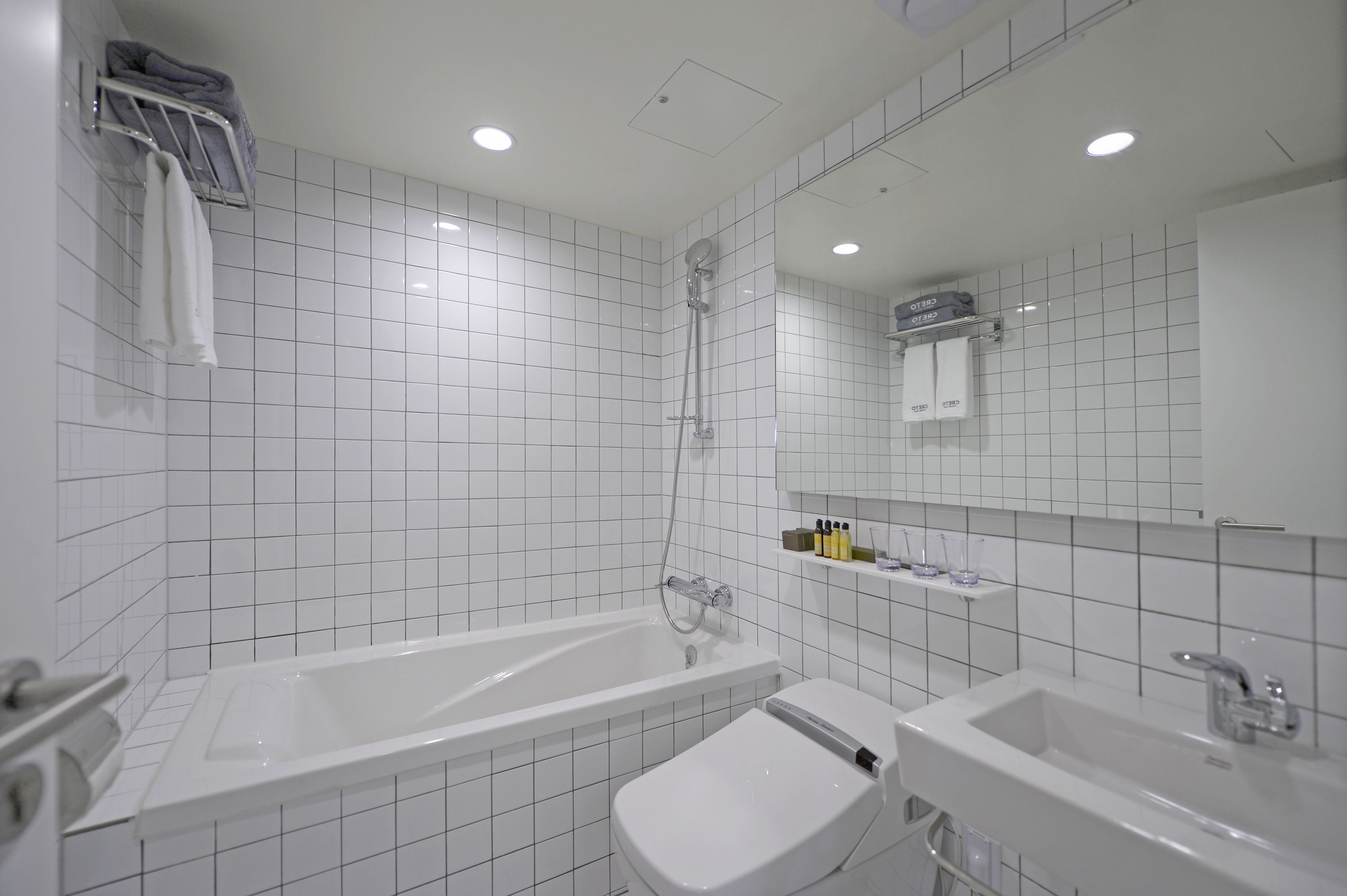 triple room (netflix available with bathtub) | bathroom | combined shower/bathtub, designer toiletries, hair dryer, slippers