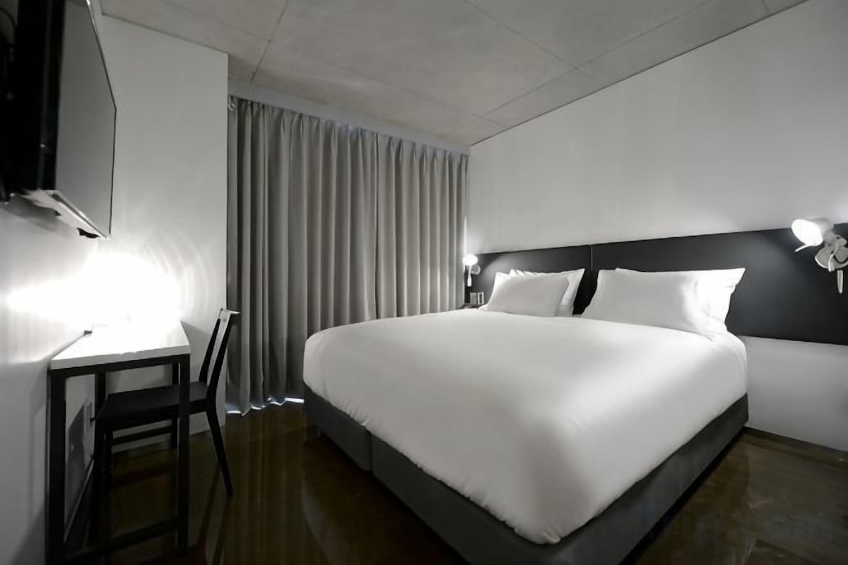 Premium bedding, down comforters, pillowtop beds, in-room safe