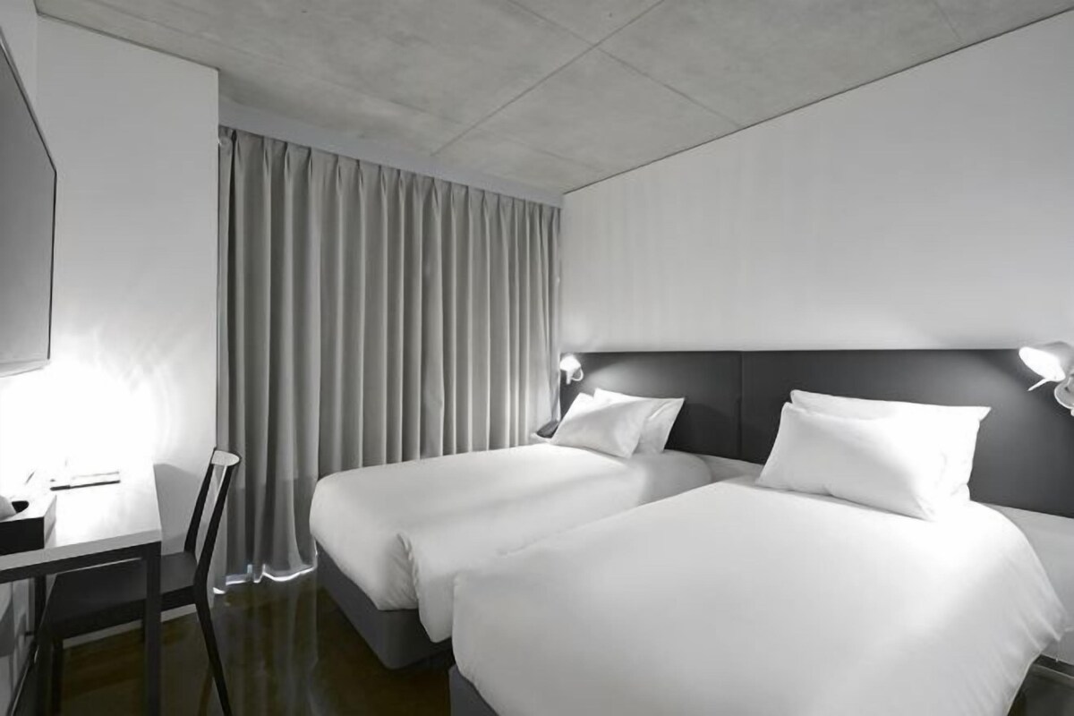 Premium bedding, down comforters, pillowtop beds, in-room safe