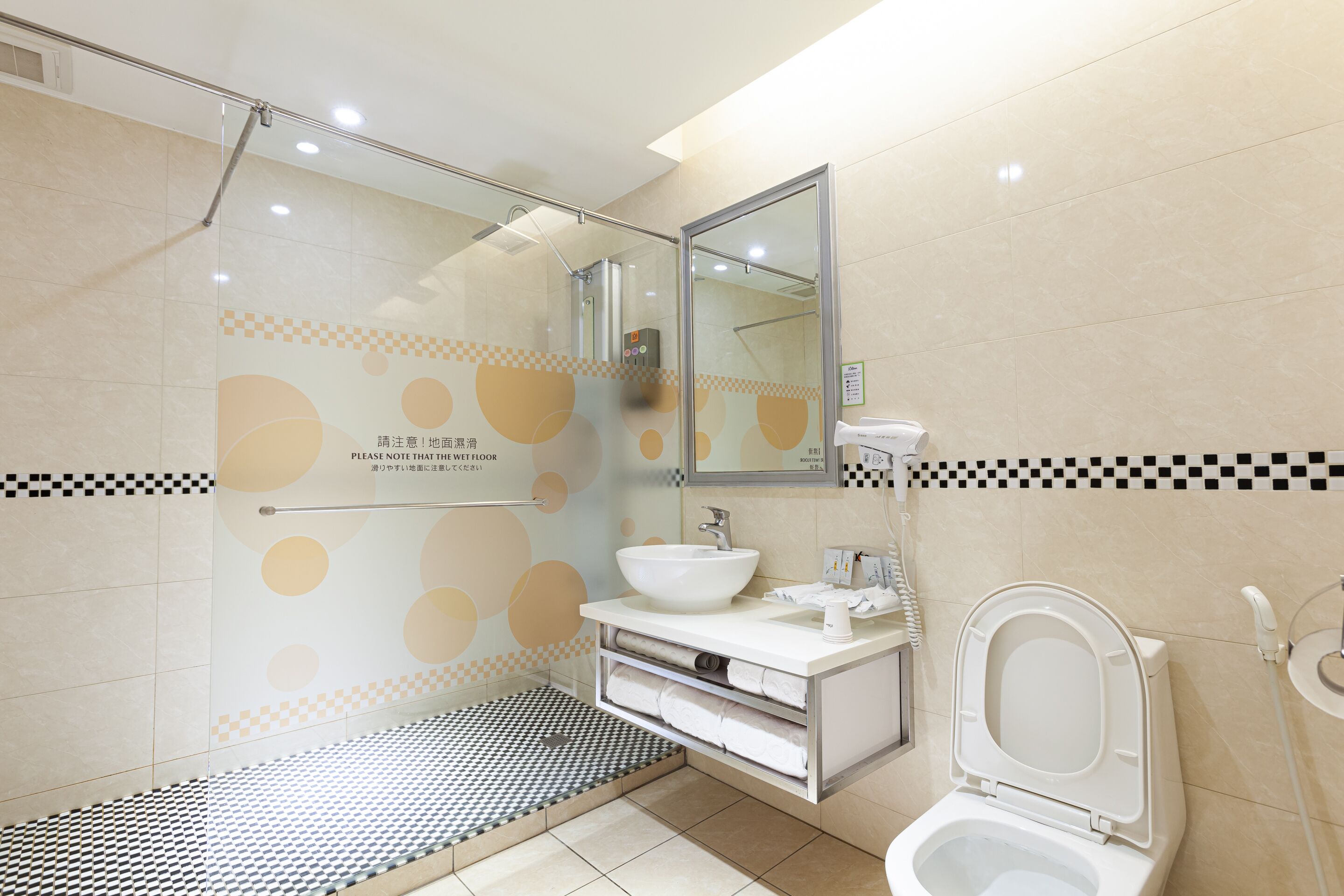 rainfall showerhead, hair dryer, slippers, towels