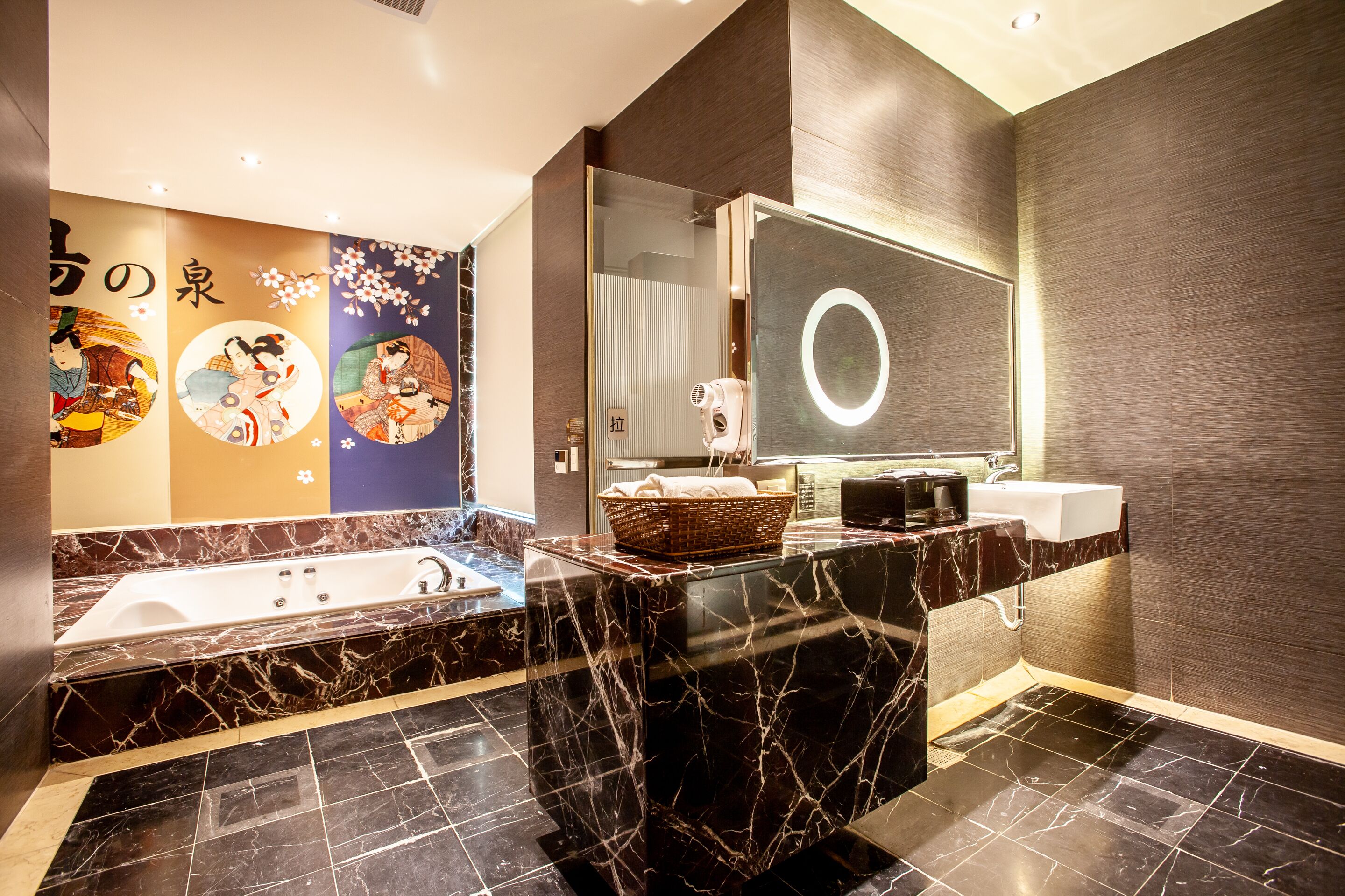 A modern bathroom with a large bathtub, a vanity with a mirror, and a wall with decorative panels.