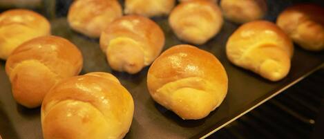 A tray of freshly baked bread rolls.