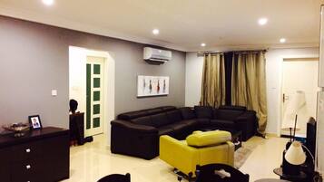 Apartment, 2 Bedrooms, Pool Access | Living room | Flat-screen TV