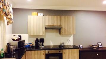 Apartment, 2 Bedrooms, Pool Access | Private kitchen | Fridge, microwave, stovetop, coffee/tea maker