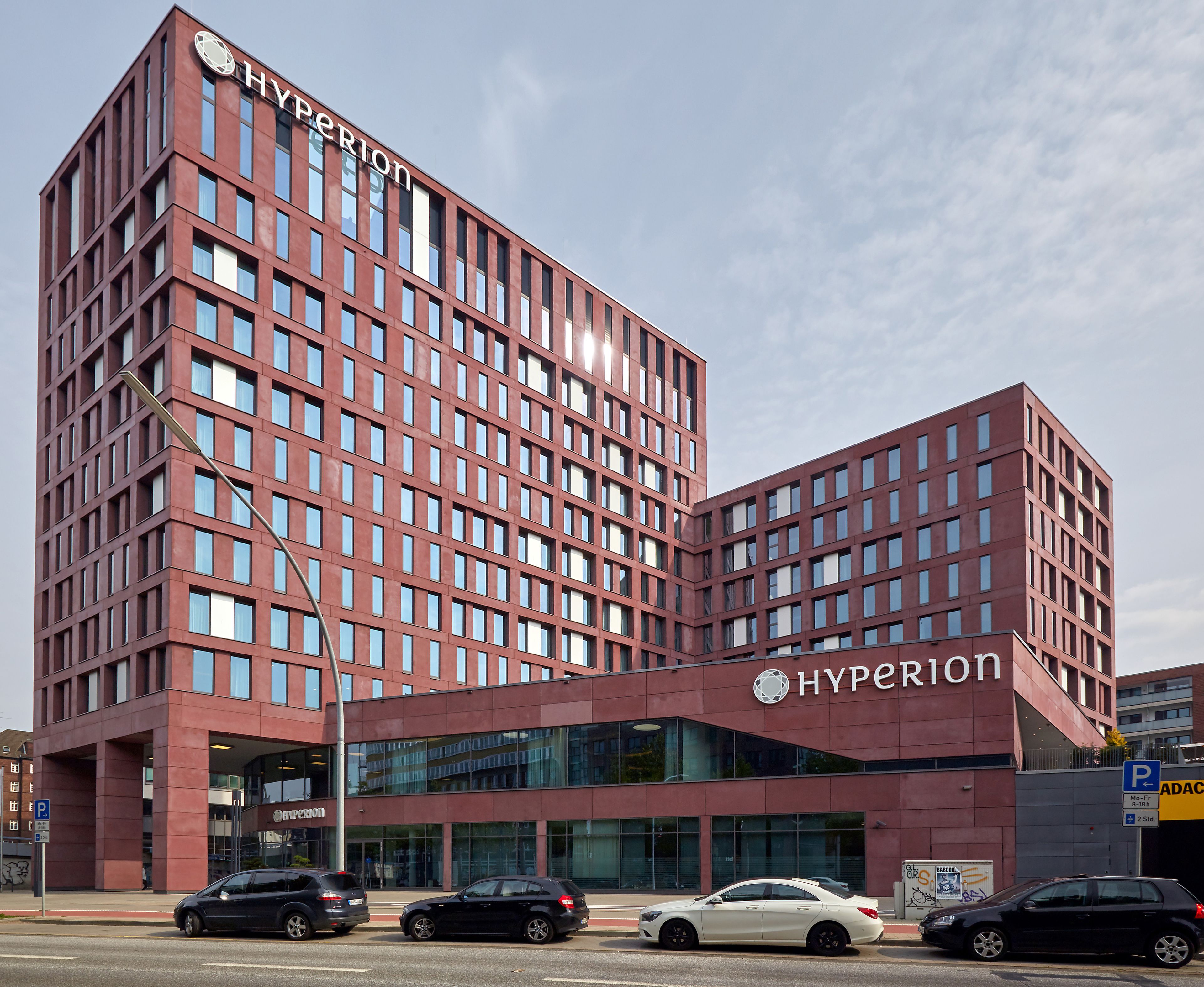 A modern red-brick building with the name "Hyperion" prominently displayed.