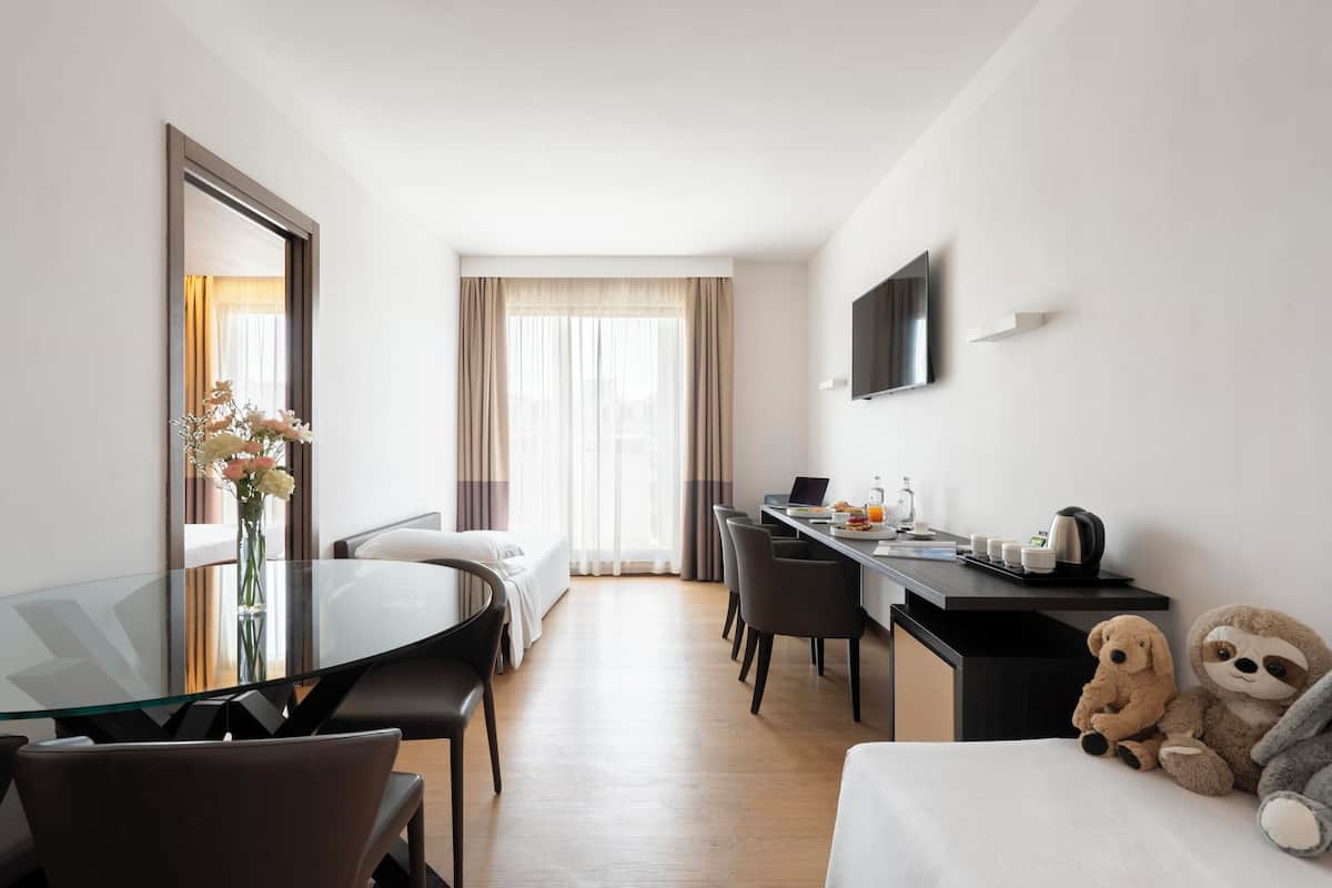 Family Quadruple Room, Balcony | In-room safe, desk, blackout drapes, soundproofing
