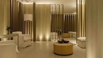 Relax in comfort with a central coffee table, a sofa, and an armchair.