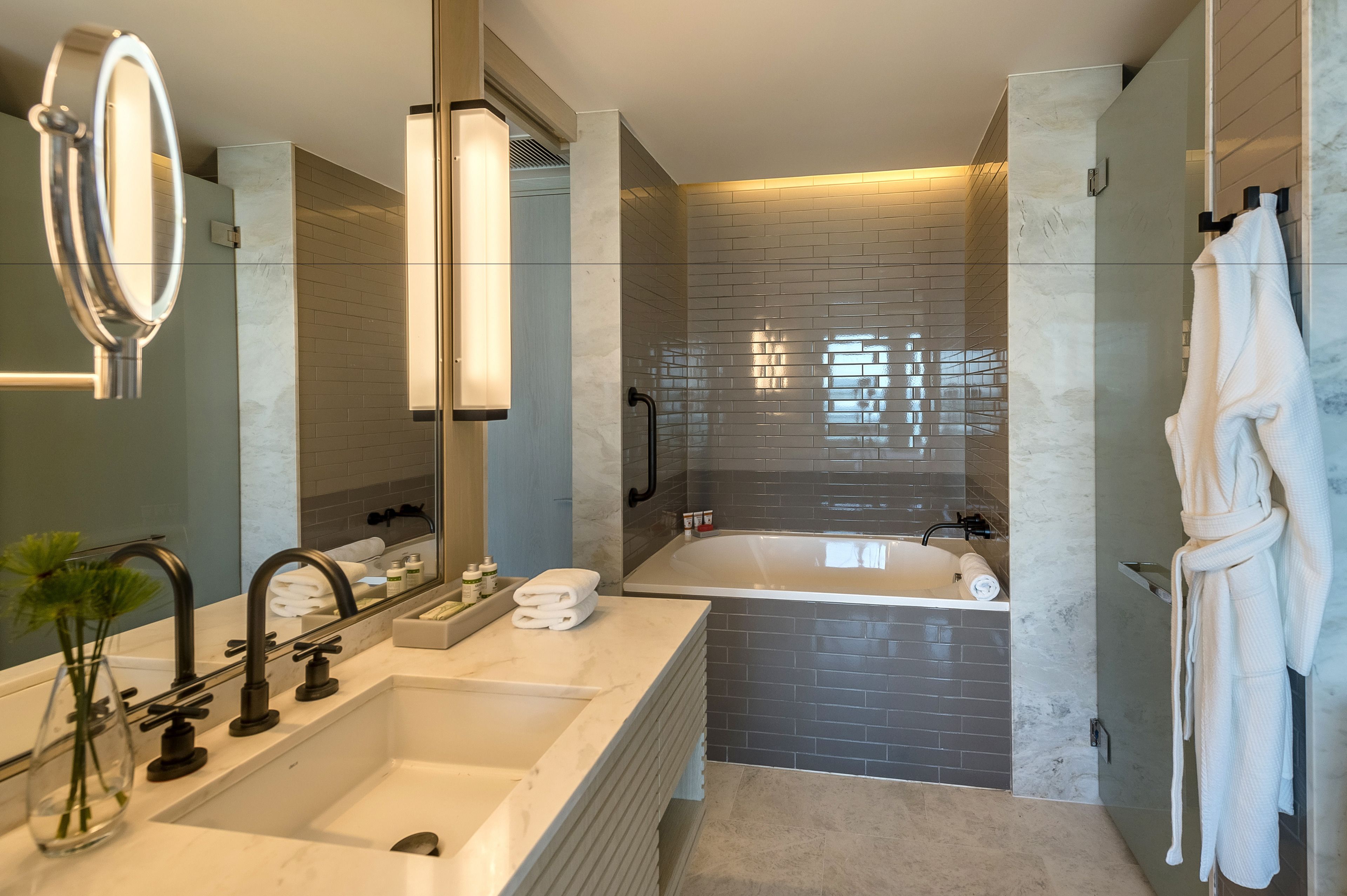 designer toiletries, hair dryer, towels