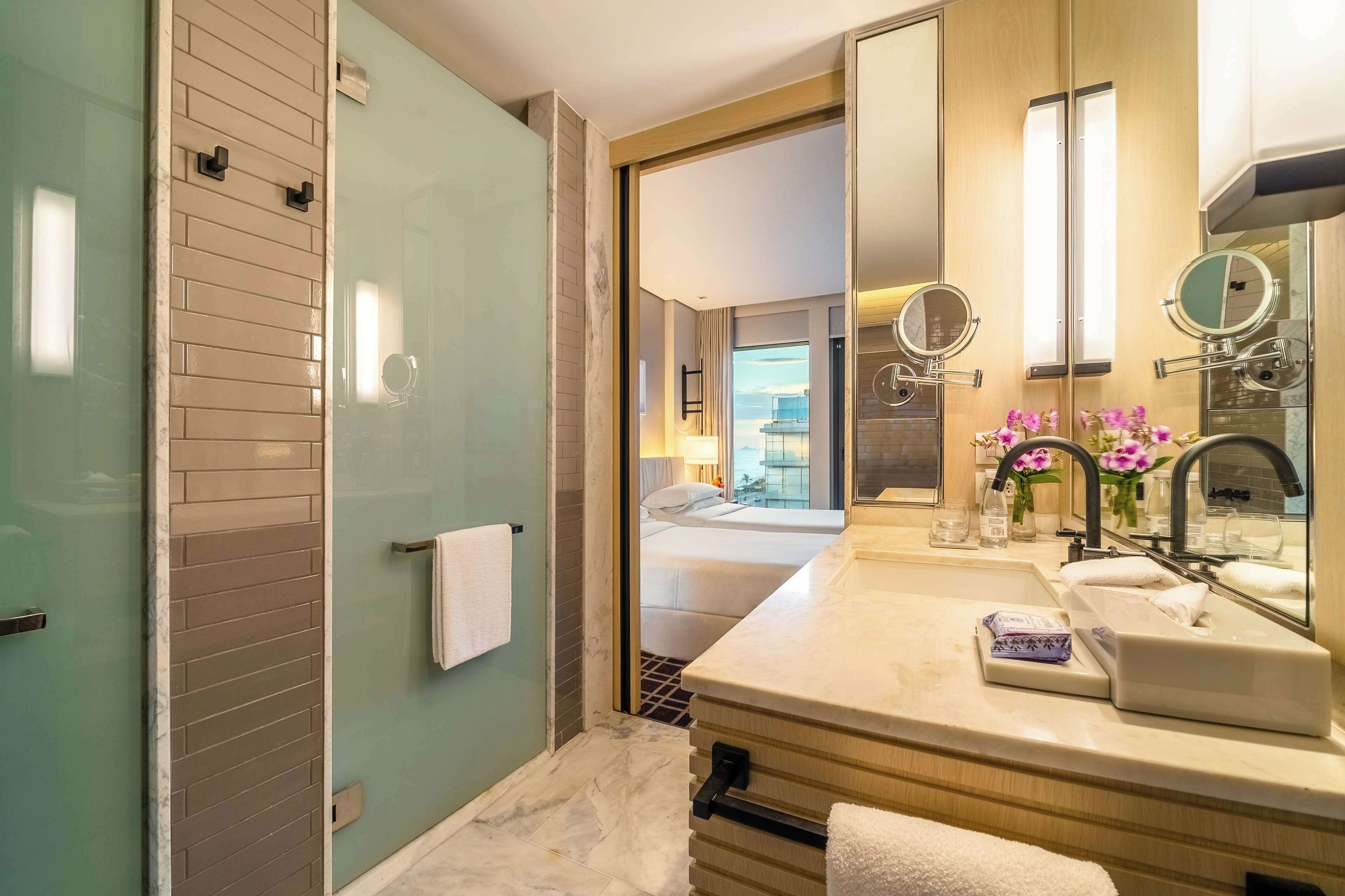 designer toiletries, hair dryer, towels