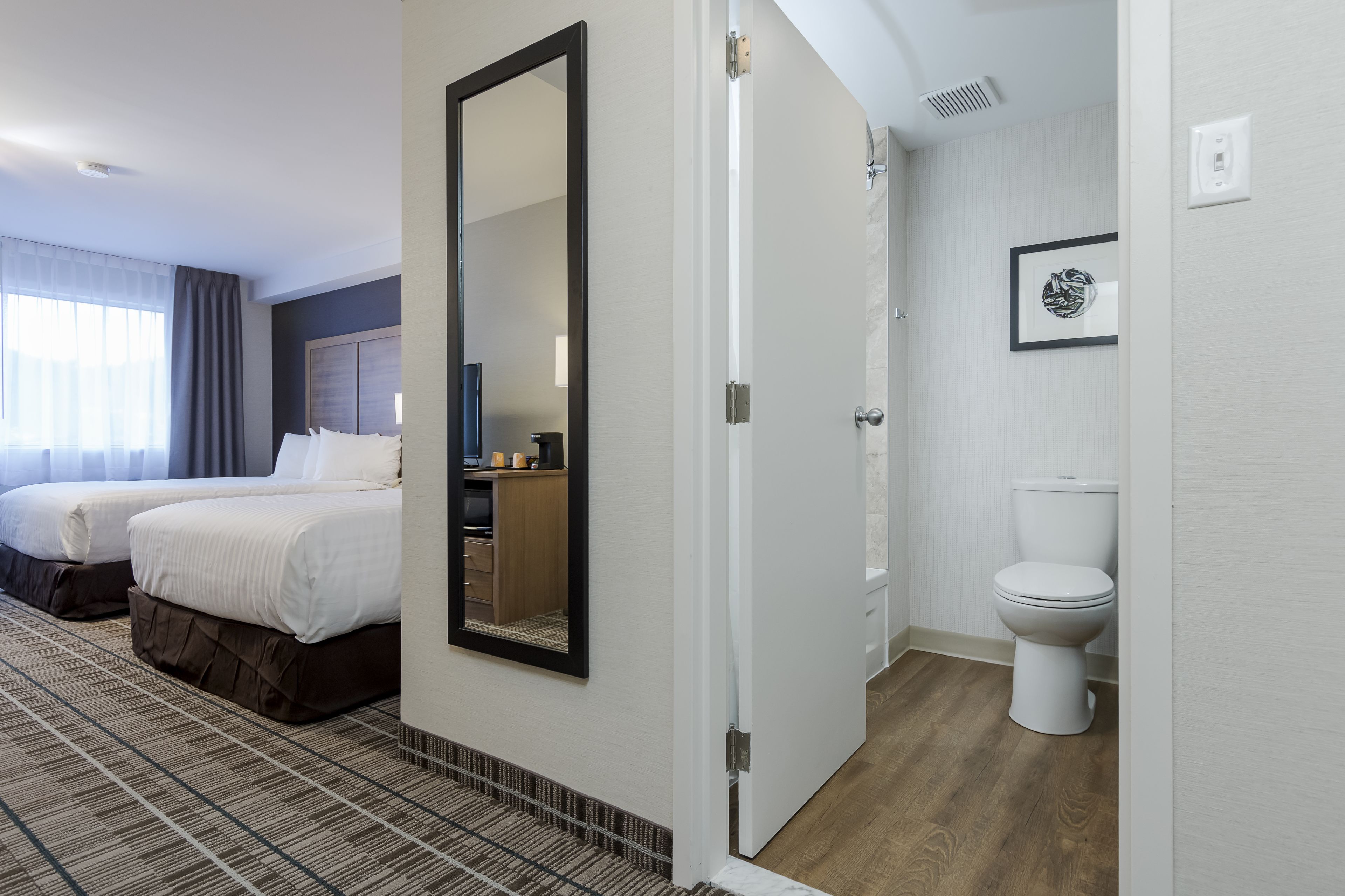 standard room, 2 queen beds, non smoking | bathroom | combined shower/bathtub, rainfall showerhead, free toiletries