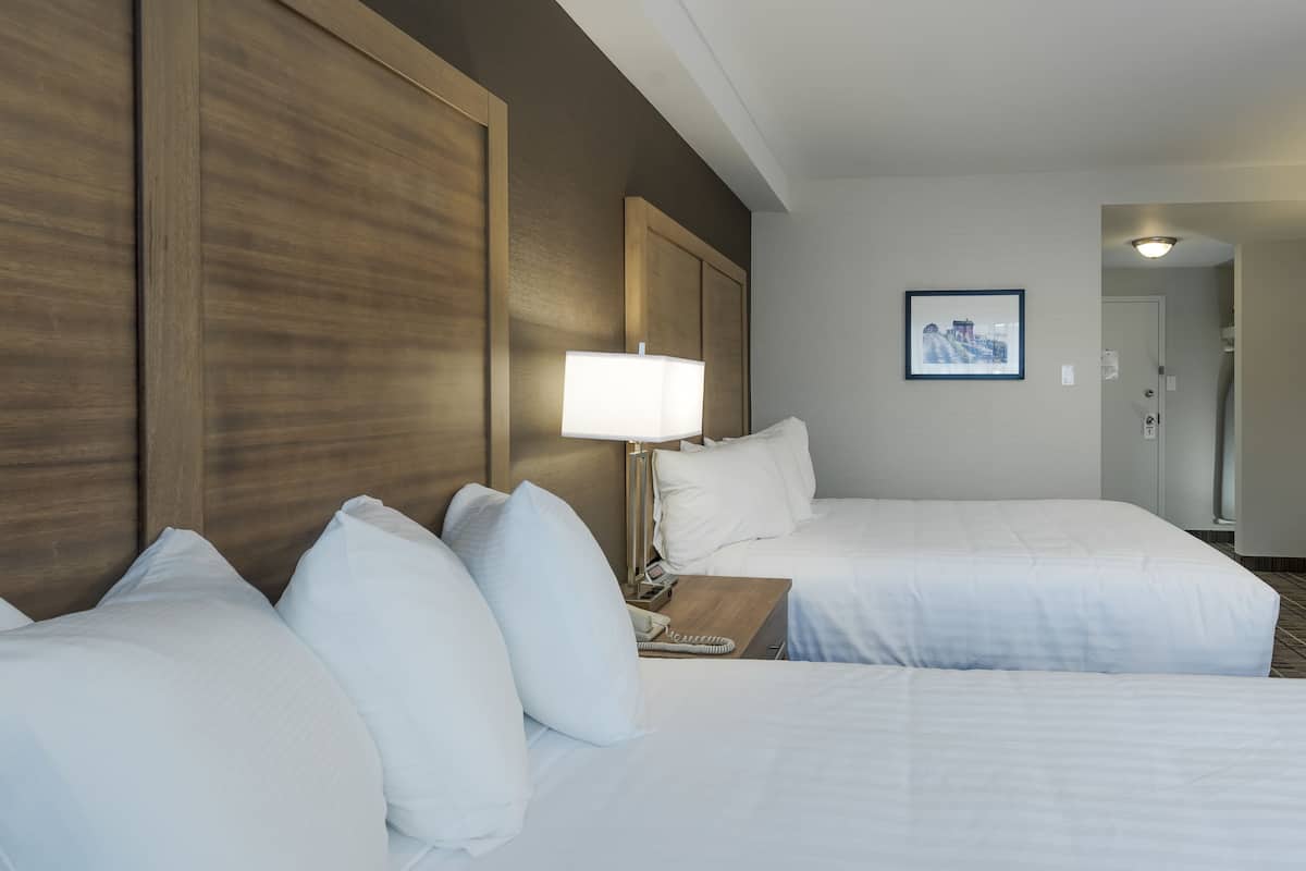 standard room, 2 queen beds, non smoking | desk, blackout curtains, iron/ironing board, free cots/infant beds