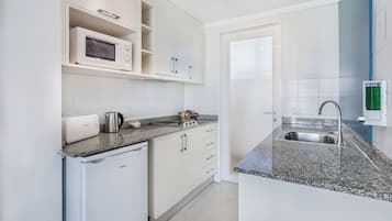 Apartment, 1 Bedroom | Private kitchen | Full-sized fridge, microwave, stovetop, coffee/tea maker