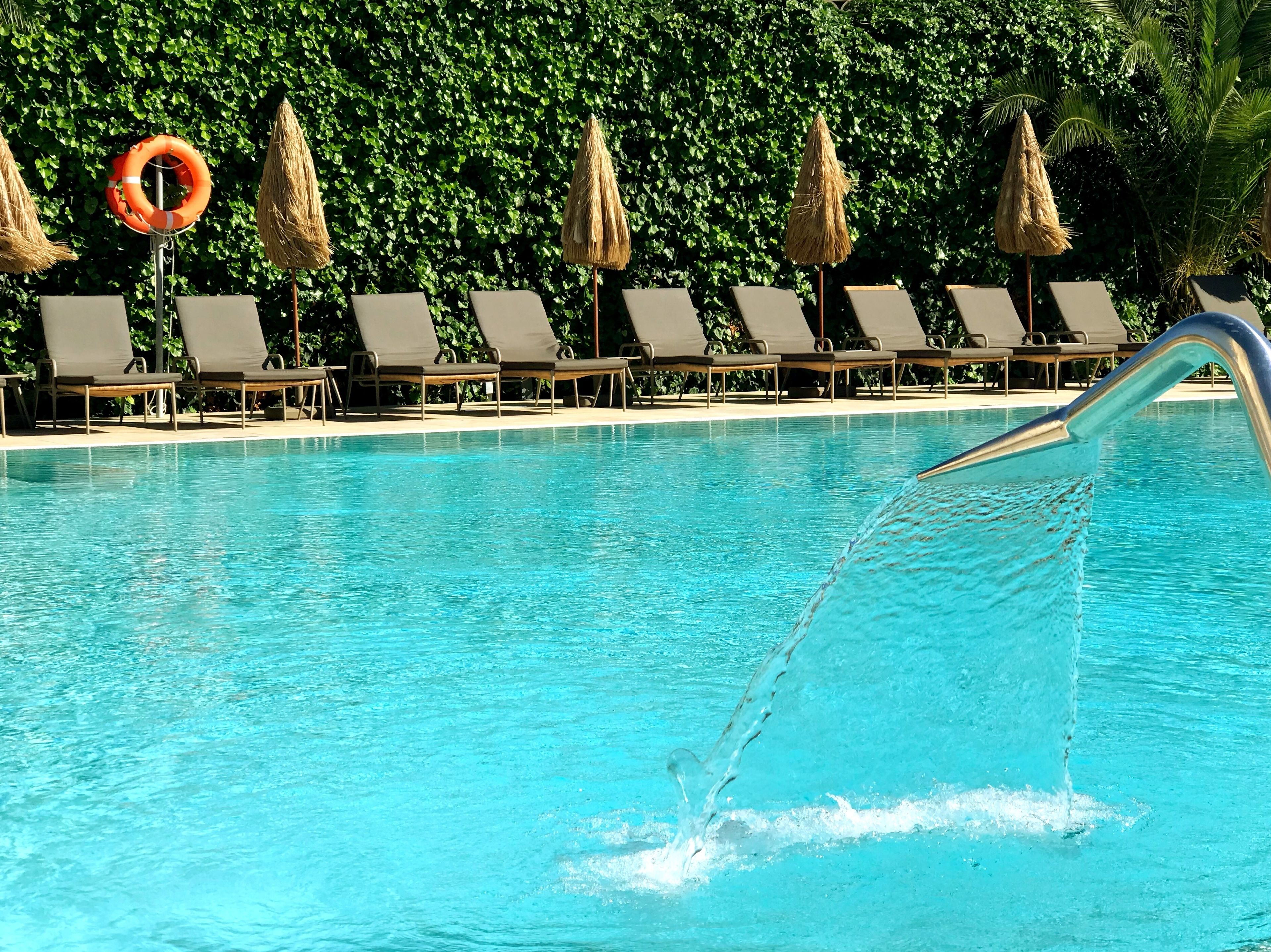 outdoor pool, open 10:00 am to 8:00 pm, pool umbrellas, pool loungers