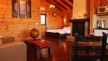 Deluxe Suite, Lake View | Living area | LED TV, fireplace, DVD player