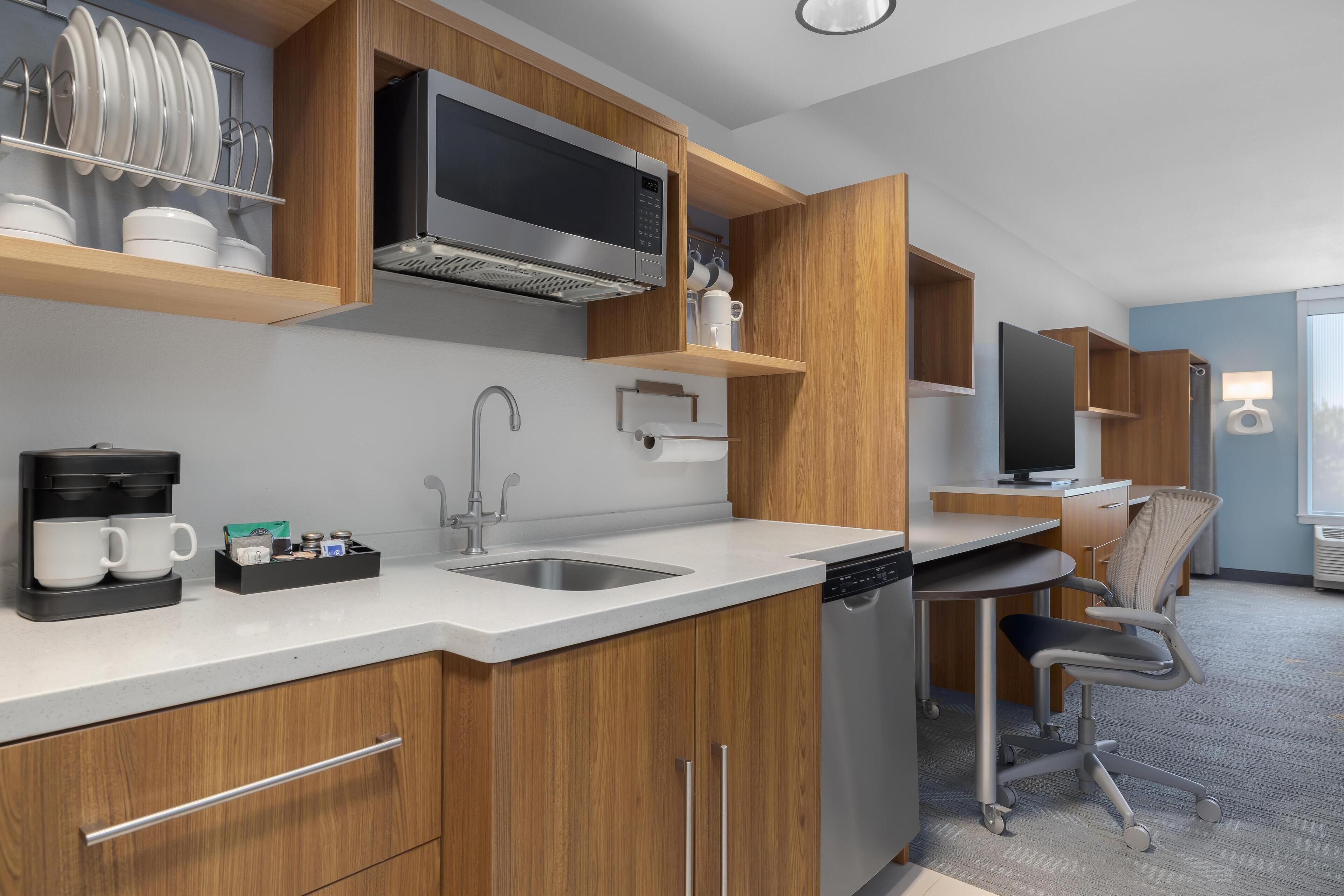 full-sized fridge, microwave, dishwasher, cookware/dishes/utensils