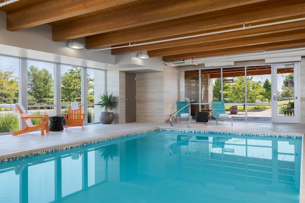 Indoor pool, open 5:00 AM to 10:00 PM, pool loungers