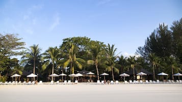 On the beach, sun loungers, beach umbrellas, beach towels