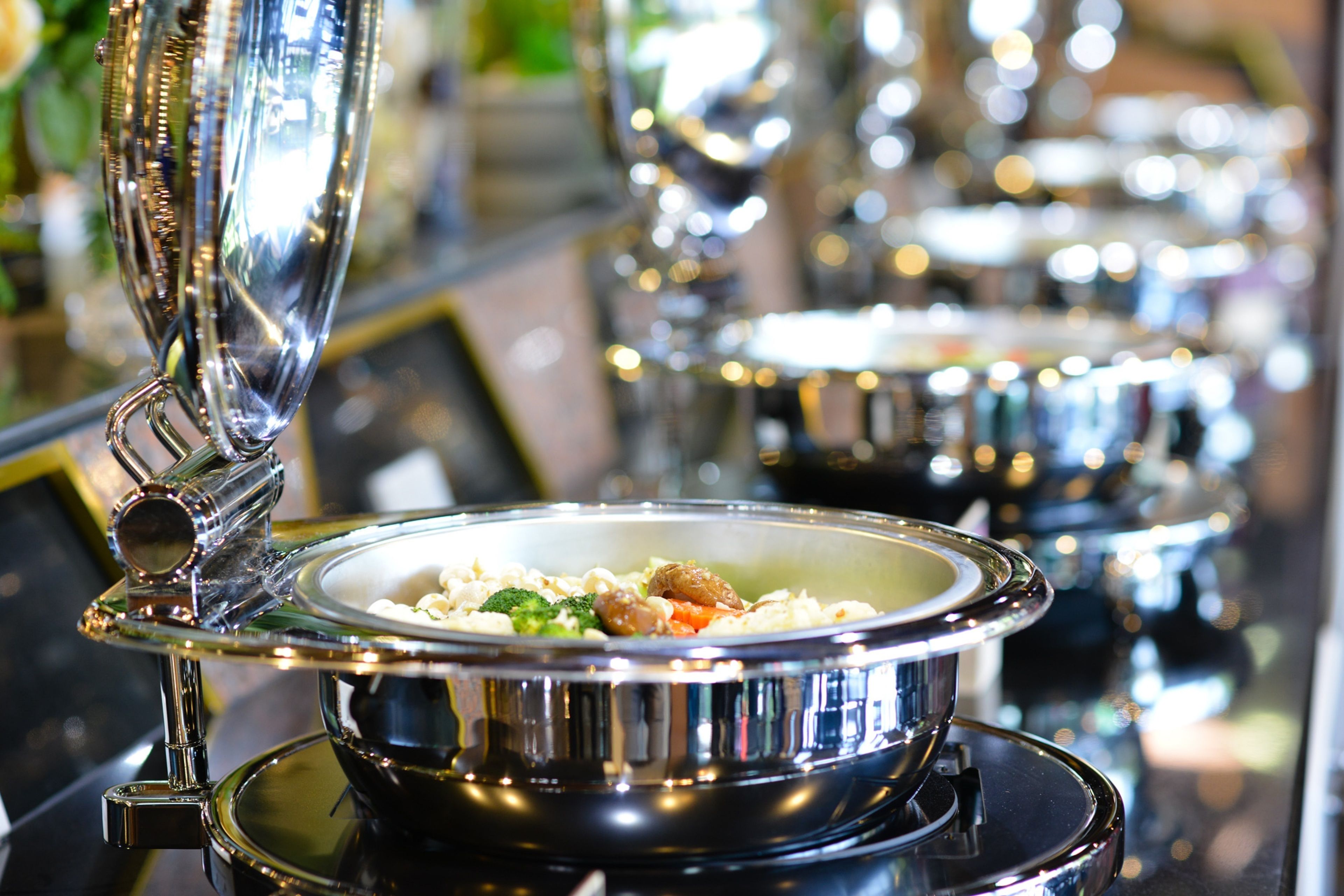 A buffet setup with multiple serving dishes and a central serving area.