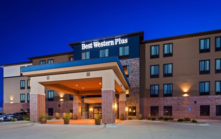 A Best Western Plus hotel with a modern design, featuring a prominent entrance with a covered area and multiple windows.