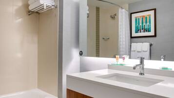 Shower, designer toiletries, hair dryer, towels